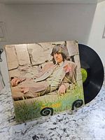 Front cover with vinyl partially visible