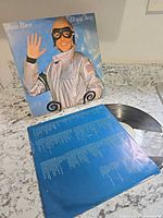 Front cover of Joan Baez album, record partly visible