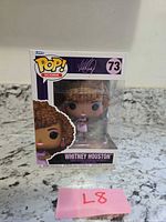 Front view of boxed Whitney Houston Funko Pop Icons #73 figure