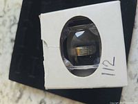 Ring inside original small white box with clear window