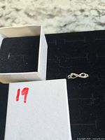 Ring beside box showing overall design