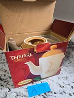 Boxed Tim Hortons teapot front view showing product image and capacity
