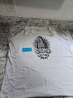Full view of front of white tank top showing graphic and size XL proportions