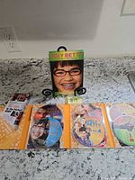 Slipcase, disc holder opened to show six discs, episode guide booklet visible