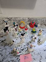 Full group of dalmatian puppy figurines and accessories