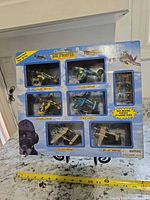 Front of sealed box showing six planes and soldier figures