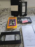 All five VHS tapes arranged on countertop