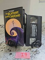 VHS cassette and illustrated sleeve shown upright