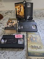 Group shot of all Lord of the Rings VHS tapes and sleeves on countertop