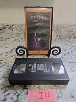 VHS cassette and case standing on counter