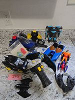 Group shot of all Batman themed toys on countertop