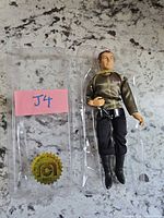 Front view of Captain Kirk figure in blister with J4 tag and holographic Mego seal
