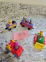 Top view of all four Ertl die-cast vehicles