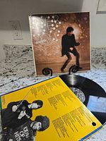 Front cover of Peter Wolf "Lights Out" LP on stand with vinyl and inner sleeve visible
