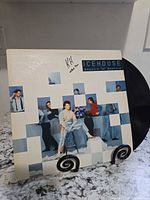 Front jacket artwork with record partially visible