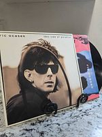 Front jacket and vinyl partially visible