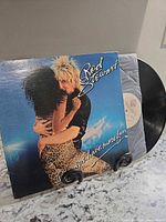 Front cover of Rod Stewart Blondes Have More Fun sleeve with vinyl partially shown
