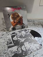 Front jacket, inner sleeve collage, vinyl disc