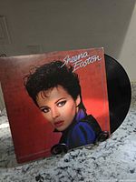 Front of album jacket and partially removed vinyl record