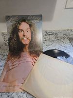 Front cover of album jacket and vinyl with inner sleeve