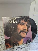 Front cover showing artist portrait and record partially visible