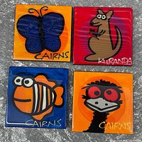 Front view of four ceramic coasters with Australian animal designs