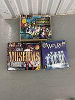 Three boxed CD-ROM titles on floor