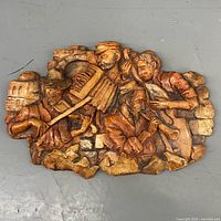 Front view of ceramic wall plaque with musician scene