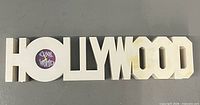 Front view of clock spelling HOLLYWOOD