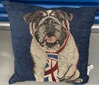 Front view of navy cushion showing bulldog tapestry design