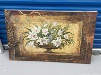 Front view of canvas wall art showing floral still life and border