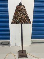 Full view of lamp with leopard print shade