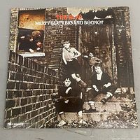 Front sleeve showing album art and wear