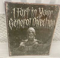 Front of metal poster showing text and image