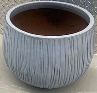 Full view of round ribbed ceramic planter