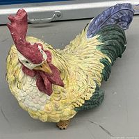 Top view of painted rooster figurine showing overall colour and form