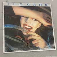 Front cover of "The Cars" album sleeve showing wear and creases