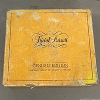 Top view of worn yellow outer box with Trivial Pursuit logo