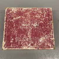 Top view of worn maroon outer box labeled Trivial Pursuit Baby Boomer Edition