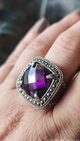 Ring on hand showing amethyst color and marcasite halo