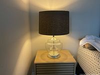 Full view of lamp on nightstand showing overall design