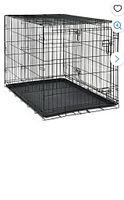 dog crate assembled with tray inserted