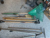 Group shot of all seven garden tools laid on floor