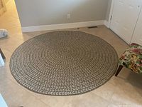Full view of circular rug placed on tile floor