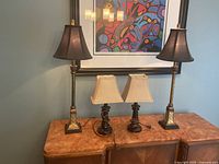 All four lamps arranged on sideboard