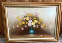 front view of framed floral oil painting