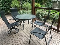 Full patio set showing table and four chairs
