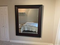 Full view of large wall mirror showing size and frame