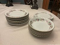 Stacked dinner plates and soup bowls on table