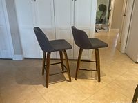 Both swivel bar chairs front-side view